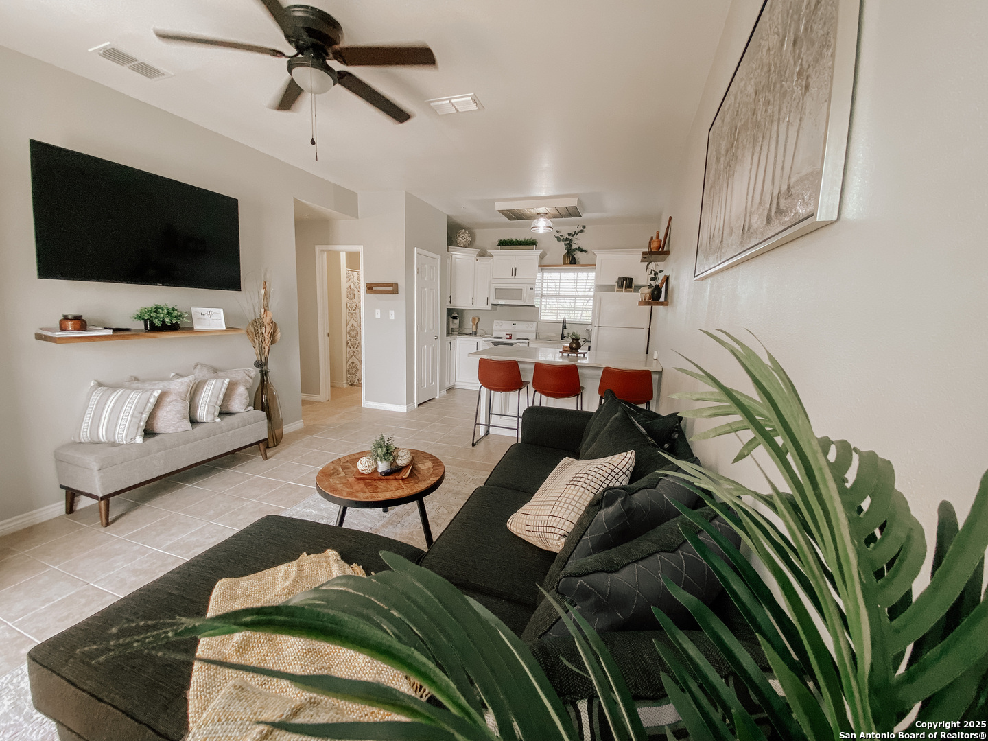 391 Riverside Drive, Unit 21 Eagle Pass, TX 78852 - Photo 1 of 11 a living room with furniture and a flat screen tv
