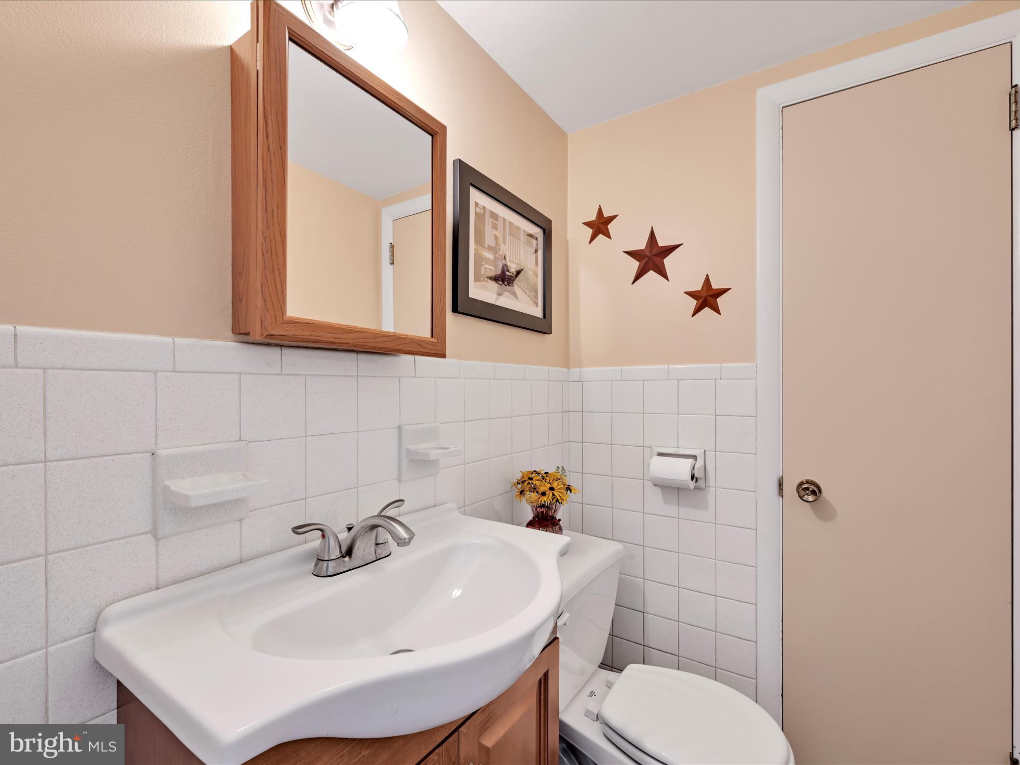 1774 Sammar Road Lancaster, PA 17601 - Photo 17 of 38 a bathroom with a sink mirror and toilet