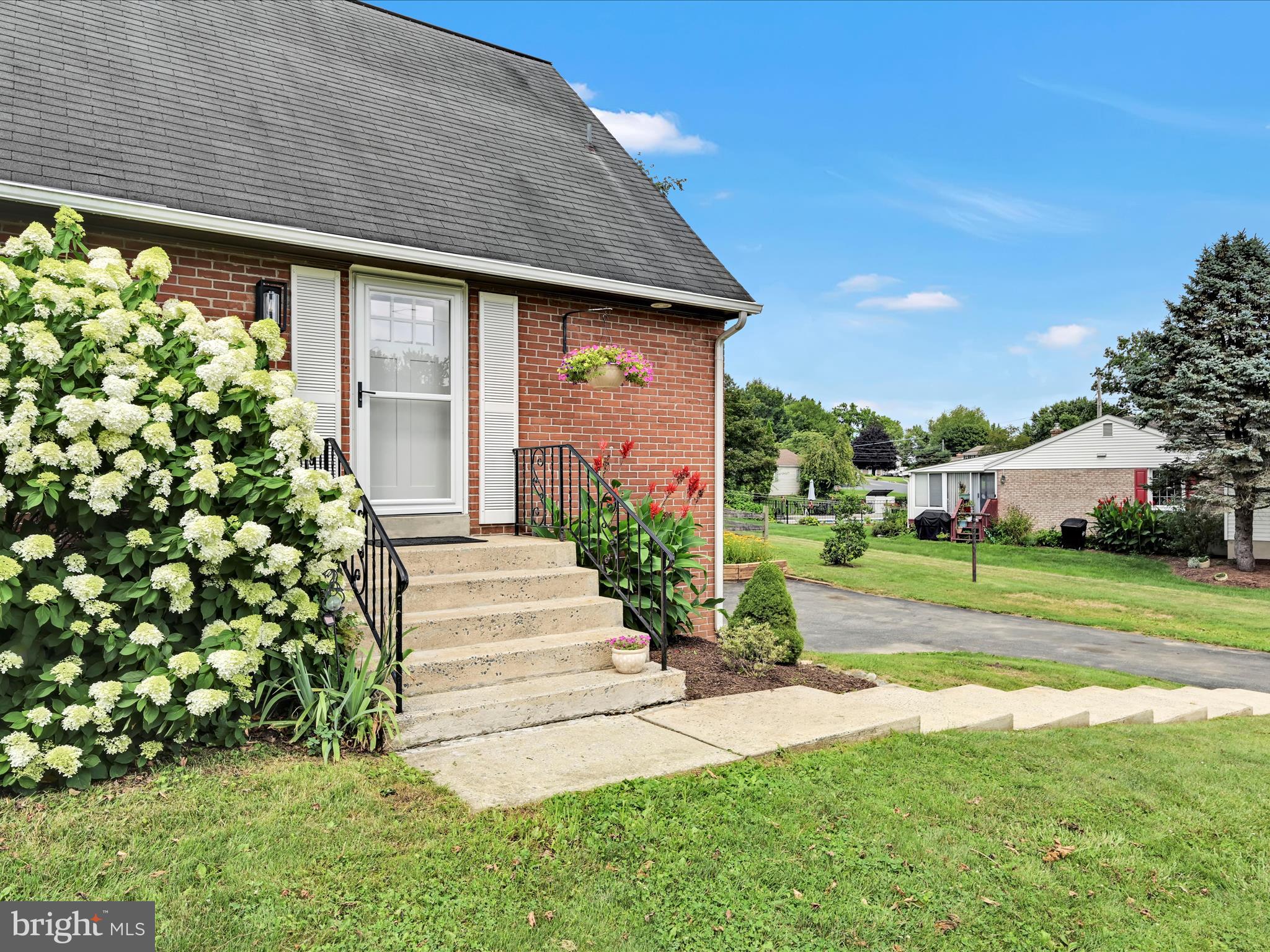 1774 Sammar Road Lancaster, PA 17601 - Photo 4 of 38 a front view of a house with a yard