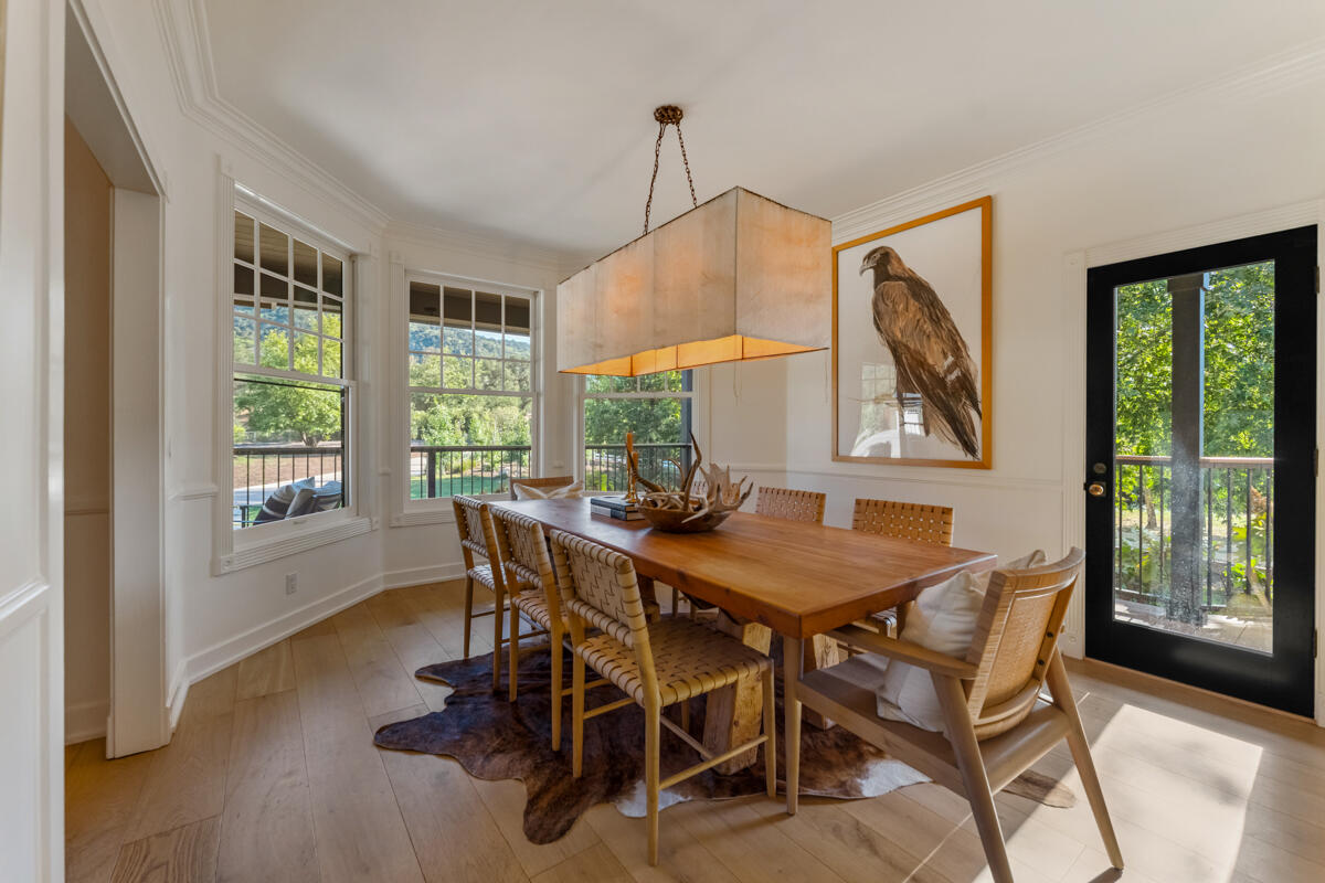 13100 Ojai Road Santa Paula, CA 93060 - Photo 9 of 60 a dining room with furniture a rug and wooden floor