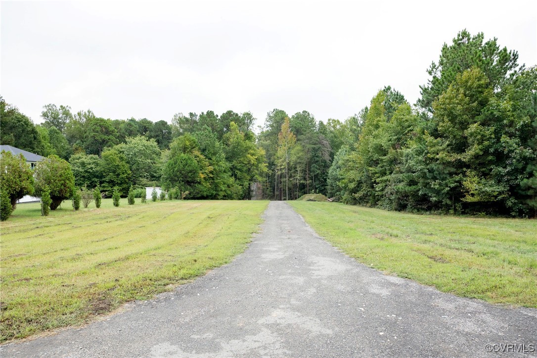 1210 Old Hundred Road Midlothian, VA 23114 - Photo 1 of 1 a view of a yard with a trees
