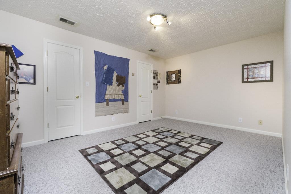 4010 Glen Raven Road Adams, TN 37010 - Photo 18 of 27 a view of a livingroom with wooden floor and windows