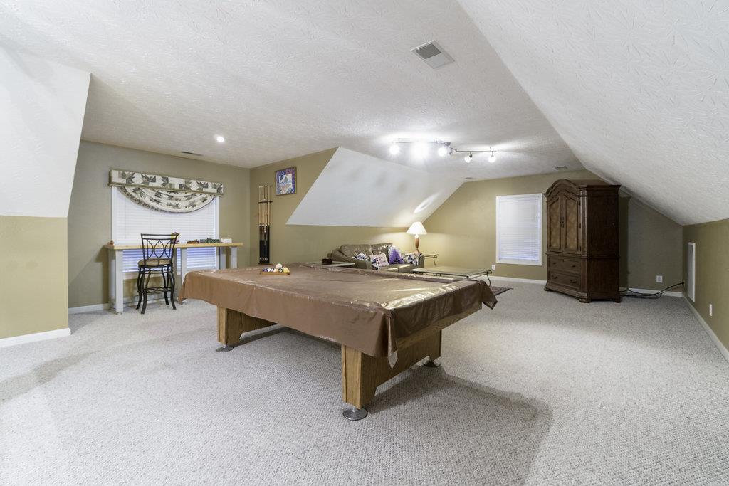 4010 Glen Raven Road Adams, TN 37010 - Photo 24 of 27 a spacious bedroom with a bed and a table in it