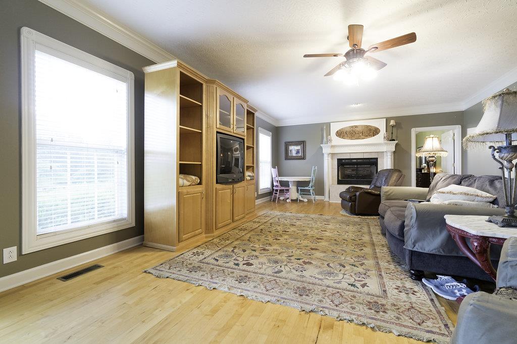 4010 Glen Raven Road Adams, TN 37010 - Photo 6 of 27 a living room with furniture fireplace and a large window