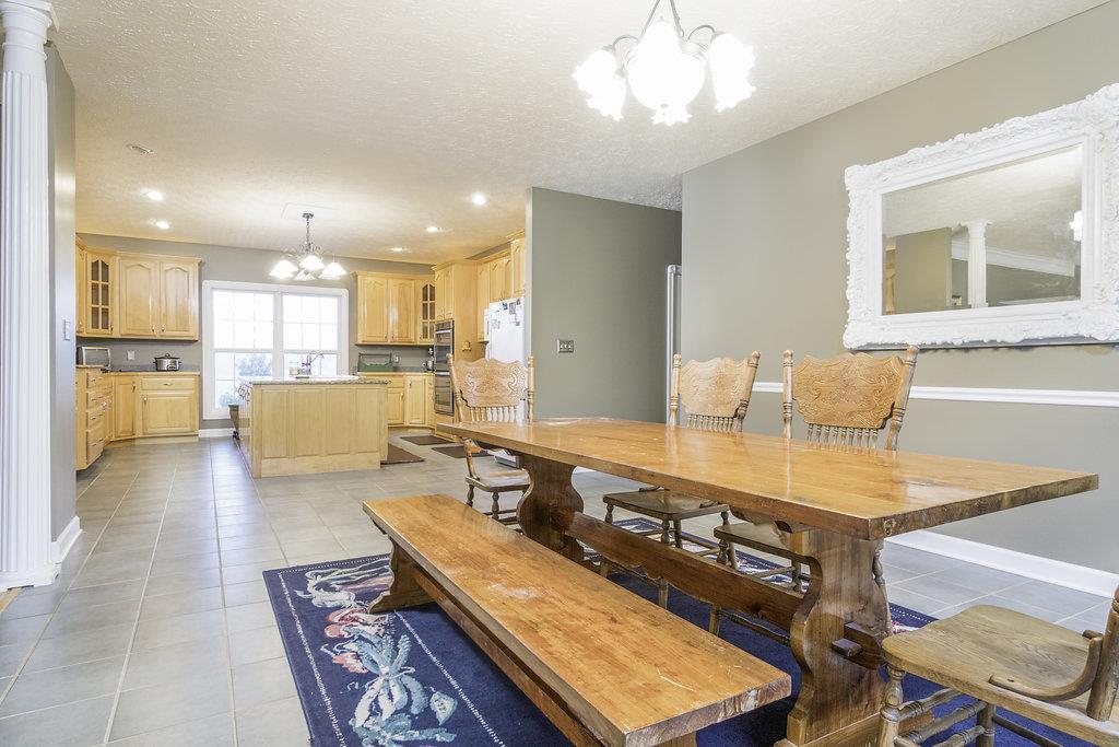 4010 Glen Raven Road Adams, TN 37010 - Photo 8 of 27 a living room with stainless steel appliances kitchen island granite countertop furniture and a kitchen view