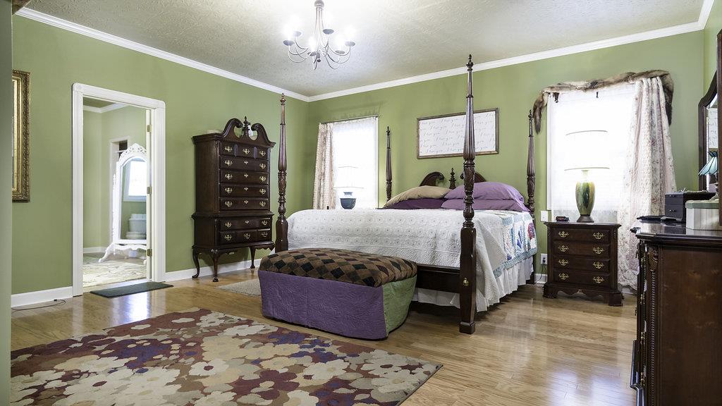 4010 Glen Raven Road Adams, TN 37010 - Photo 9 of 27 a bedroom with a bed dresser and window