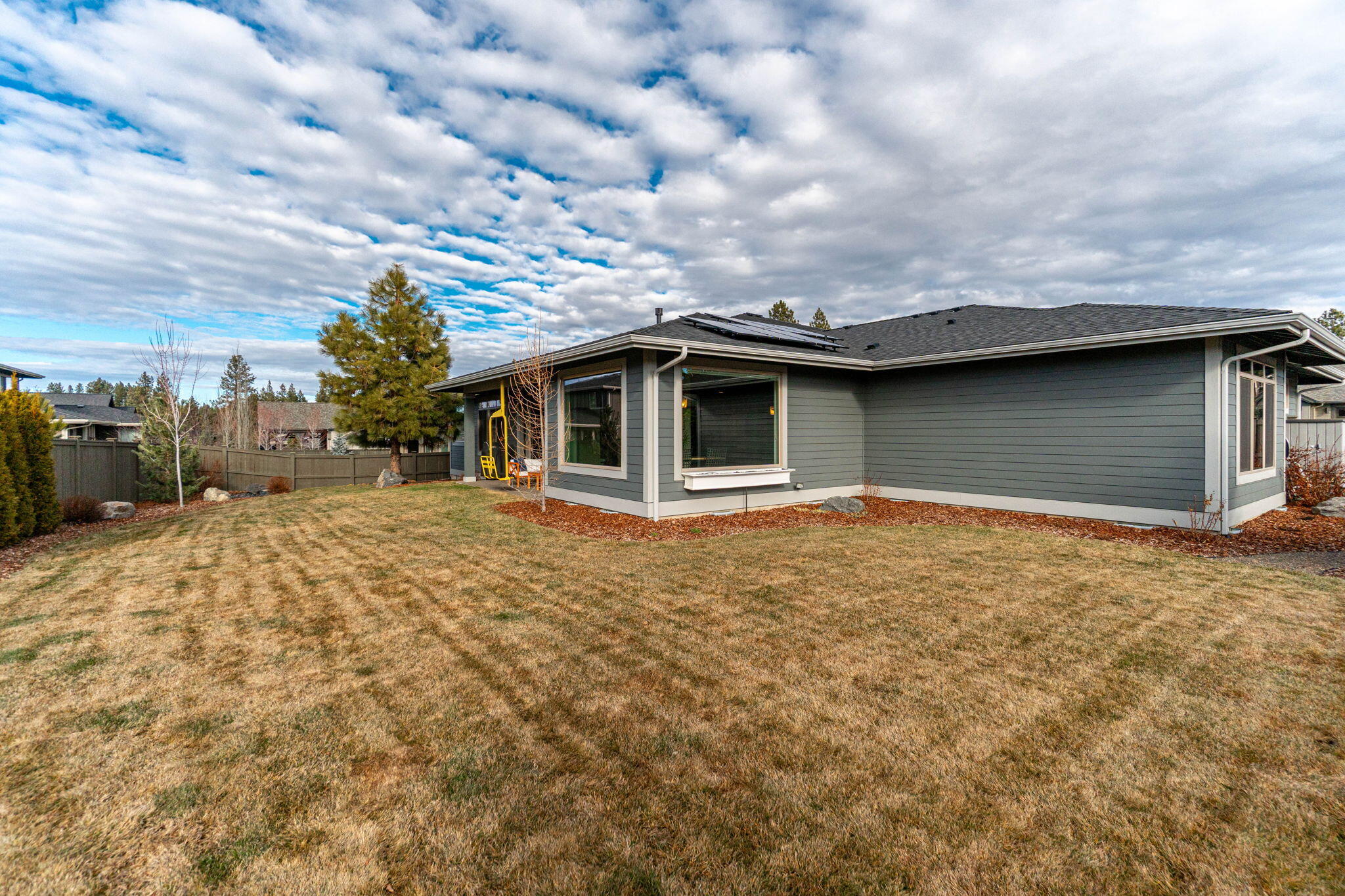 60861 Southwest Headwaters Loop Bend, OR 97702 - Photo 45 of 45 Yard out the back of the home and wraps around the side.