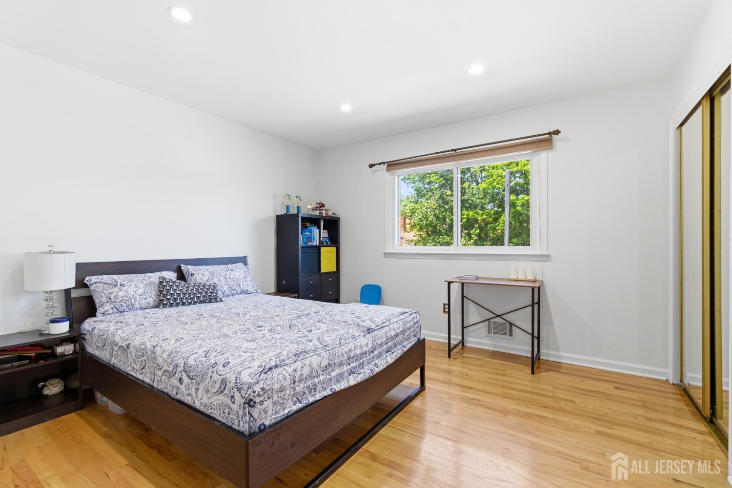 213 Normandy Road Edison, NJ 08820 - Photo 32 of 45 a bedroom with a bed and window
