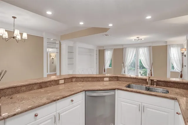 a bathroom with a sink and a large mirror