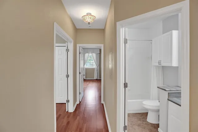 a bathroom with a toilet a sink and a mirror
