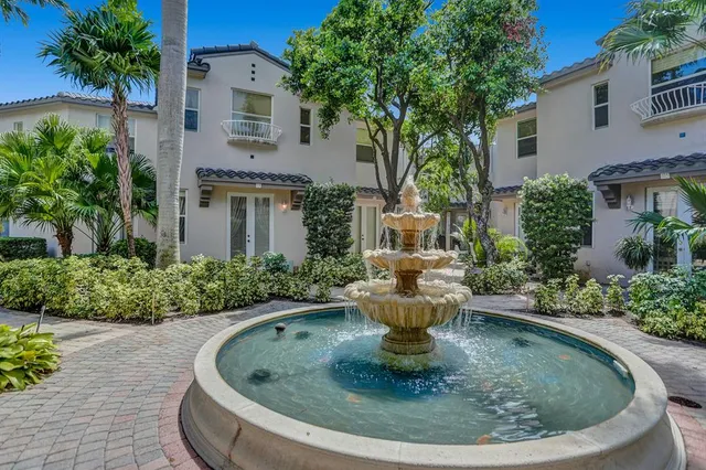 a view of a house with sitting pool
