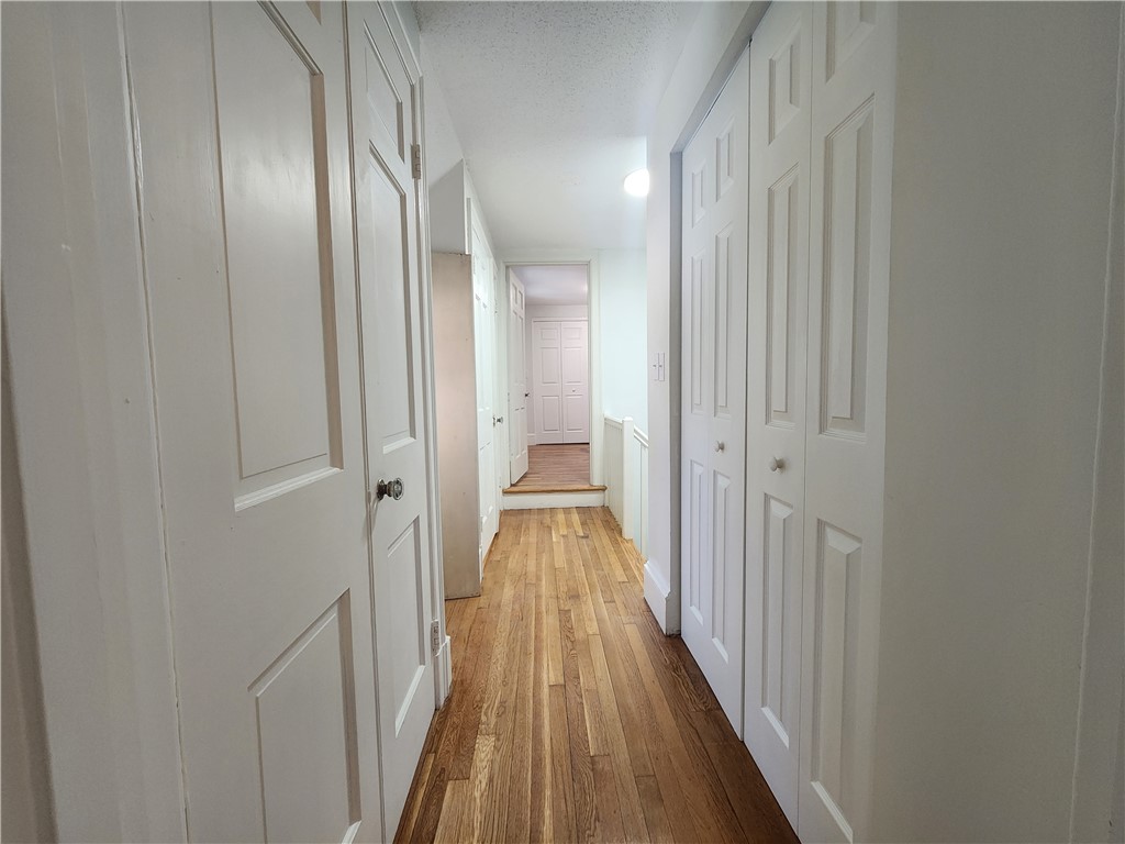 599 Harris Avenue Woonsocket, RI 02895 - Photo 28 of 48 Multiple closets in 2nd fl back hallway. To right is laundry