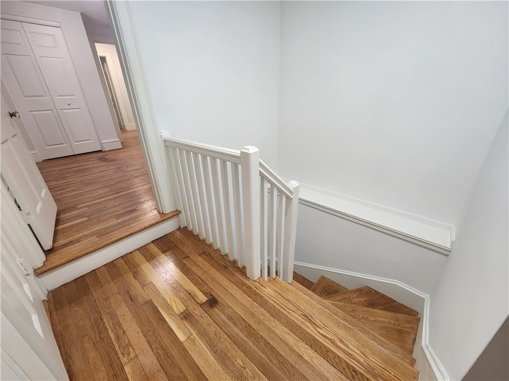 599 Harris Avenue Woonsocket, RI 02895 - Photo 33 of 48 Back stairway comes out near kitchen and back door