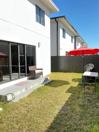 a house view with a backyard space