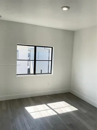 a view of a window in an empty room