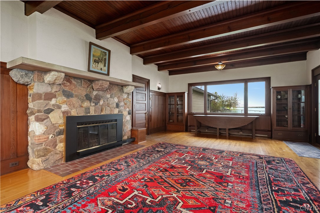 5072 West Lake Road Owasco, NY 13021 - Photo 5 of 50 Spacious living room with exposed wood beam ceilin