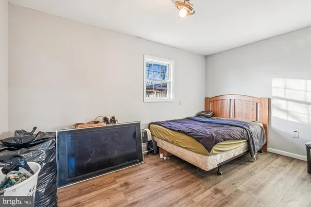 a bathroom with a sink toilet vanity and shower