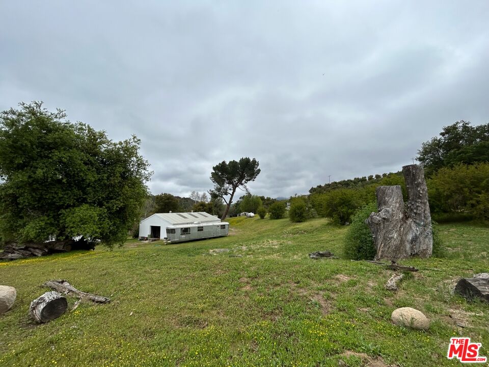 41322 De Luz Road Fallbrook, CA 92028 - Photo 11 of 29 a car parked in the middle of a field
