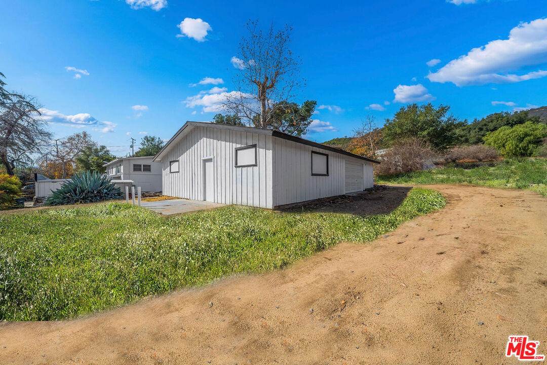 41322 De Luz Road Fallbrook, CA 92028 - Photo 14 of 29 a front view of a house with garden