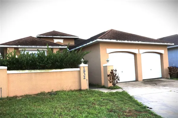 a house with trees in the background
