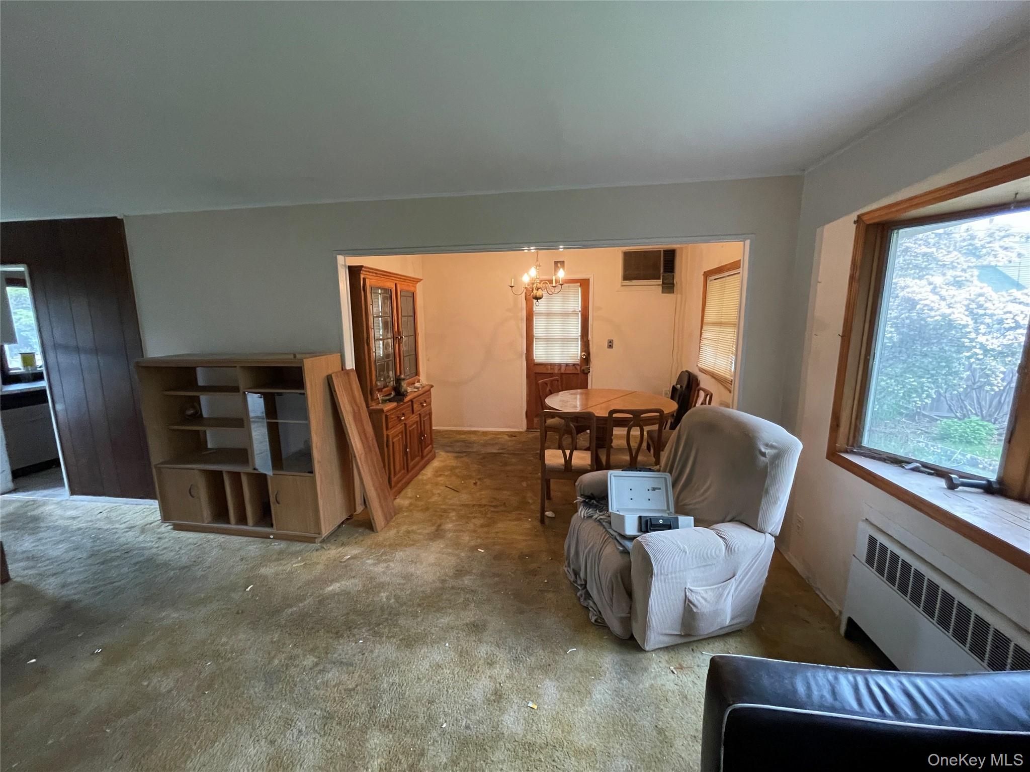 2043 Paddock Road Seaford, NY 11783 - Photo 7 of 25 a living room with furniture and a flat screen tv