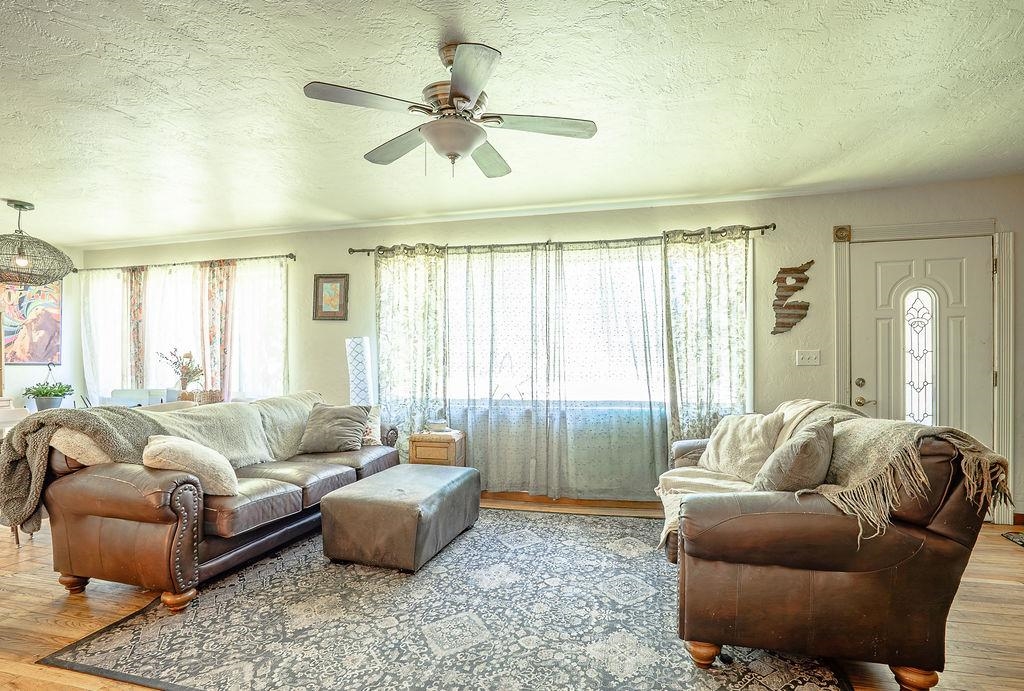 470 Riverside Avenue Chester, CA 96020 - Photo 4 of 25 a living room with furniture and a large window