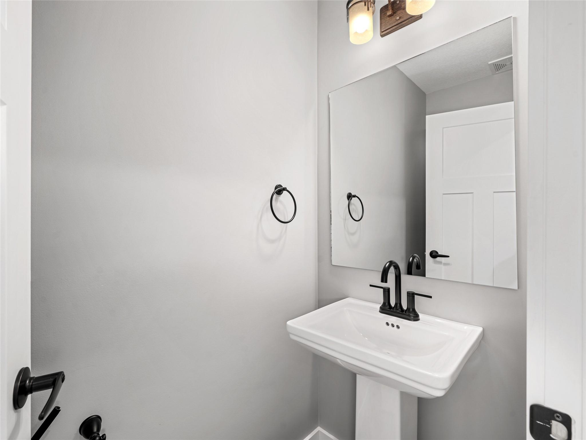 56 Trevor Trail Clyde, NC 28721 - Photo 14 of 27 a bathroom with a sink and a mirror