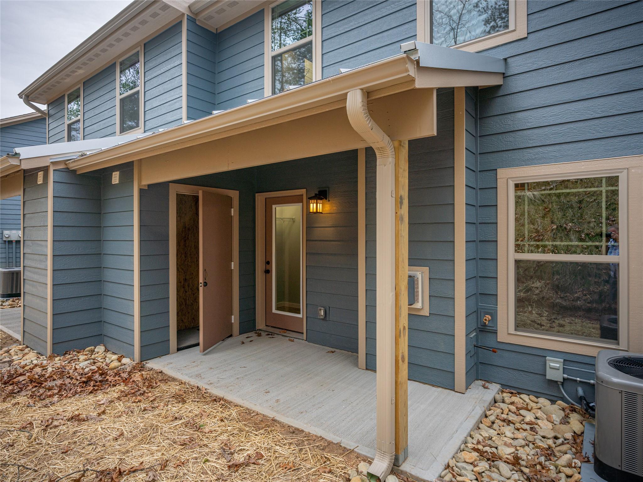 56 Trevor Trail Clyde, NC 28721 - Photo 22 of 27 a view of a house with a door and wooden walls
