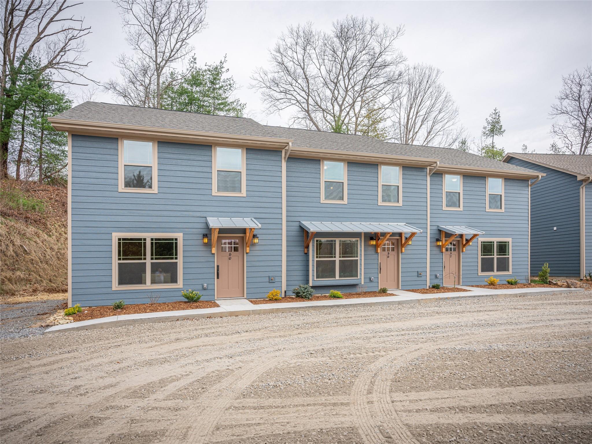 56 Trevor Trail Clyde, NC 28721 - Photo 25 of 27 a front view of a house with a road