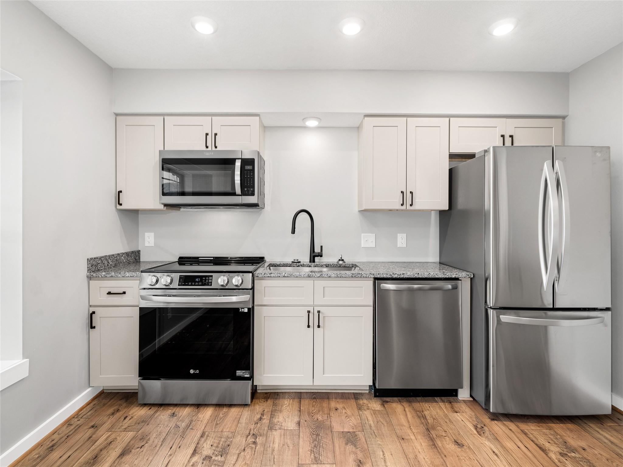 56 Trevor Trail Clyde, NC 28721 - Photo 4 of 27 a kitchen with a stove refrigerator and microwave