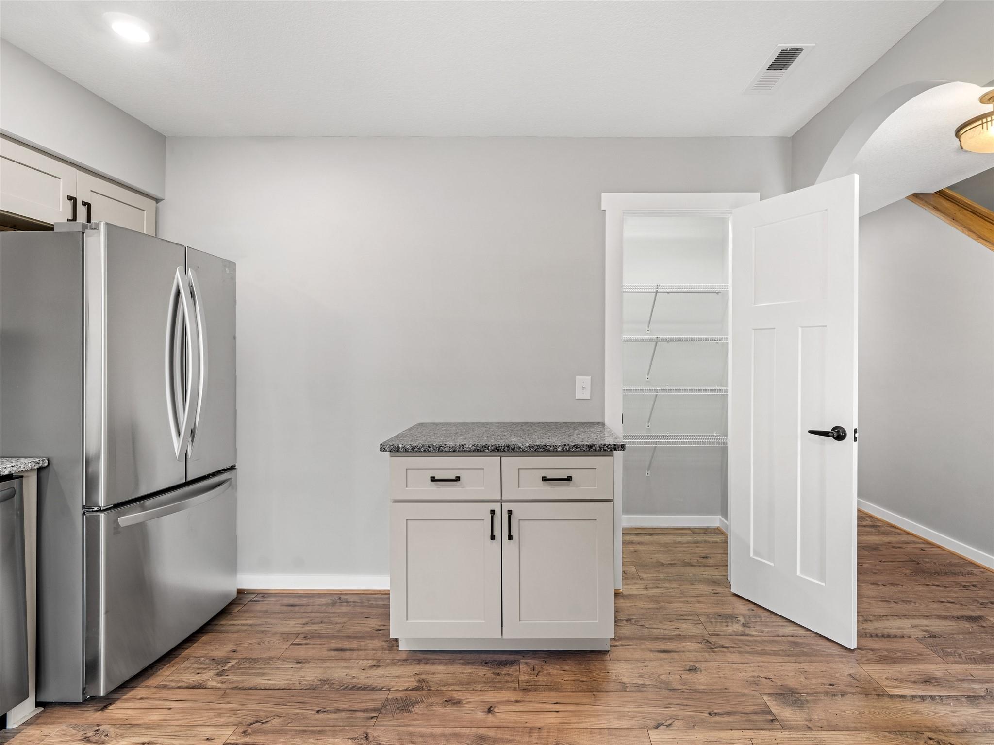 56 Trevor Trail Clyde, NC 28721 - Photo 5 of 27 a kitchen with white cabinets and a refrigerator