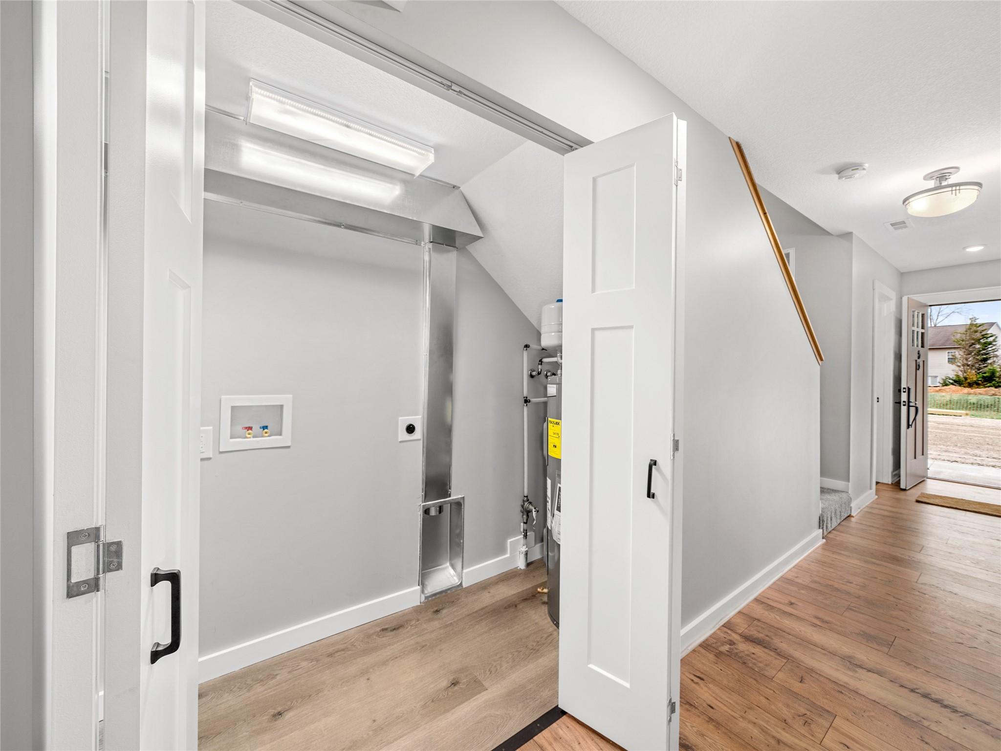 56 Trevor Trail Clyde, NC 28721 - Photo 8 of 27 a view of a hallway with wooden floor and staircase