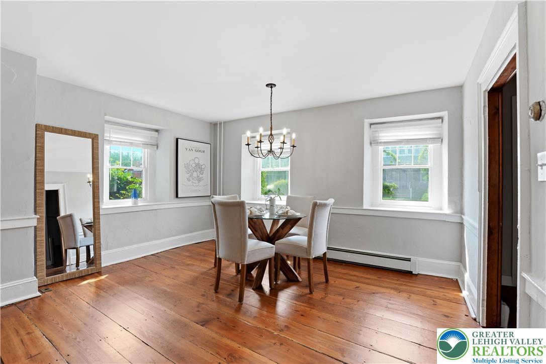 2014 Linden Street Bethlehem, PA 18017 - Photo 11 of 85 Warm hardwood flooring anchors this intimate dining area, well-lit by multiple windows and an elegant chandelier.