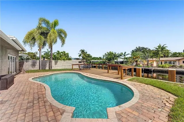 a view of a swimming pool with a patio