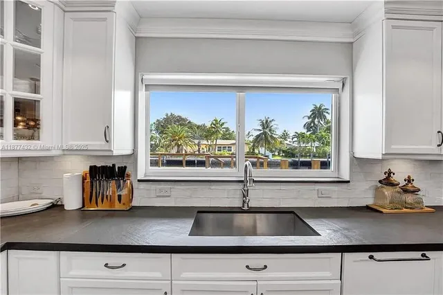 a kitchen with a sink and window