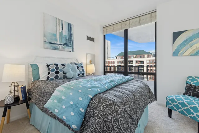 a bedroom with a large bed and a window