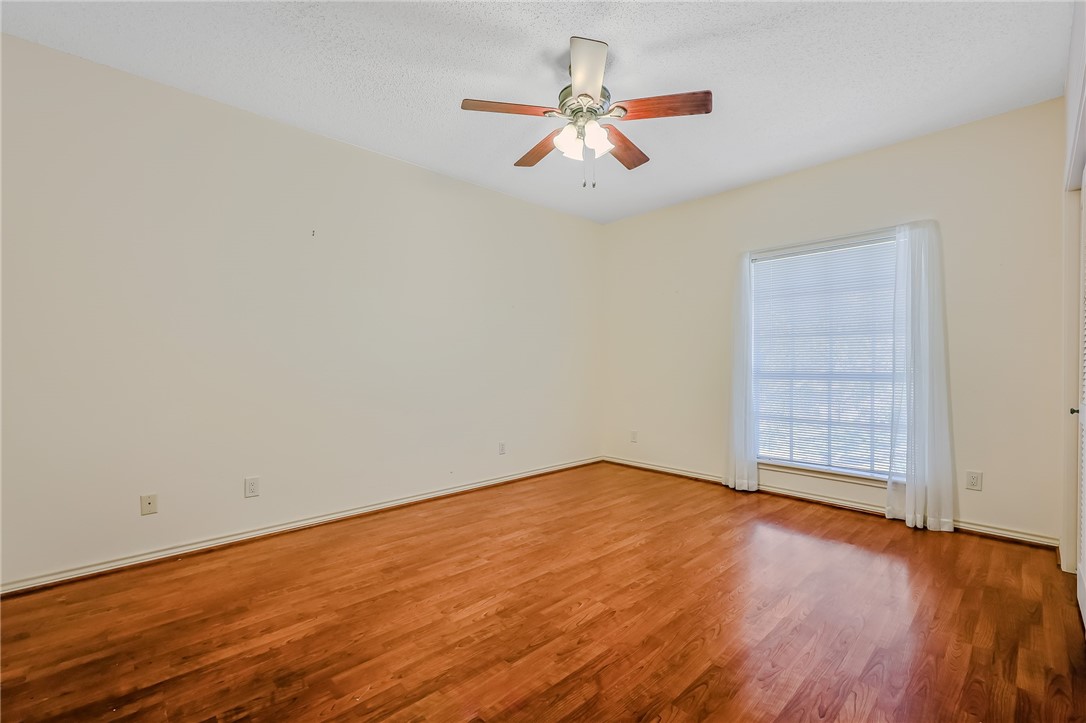 5917 Harvest Hill Road Corpus Christi, TX 78414 - Photo 34 of 40 an empty room with wooden floor and windows