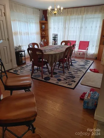 a view of a dining room with furniture and window