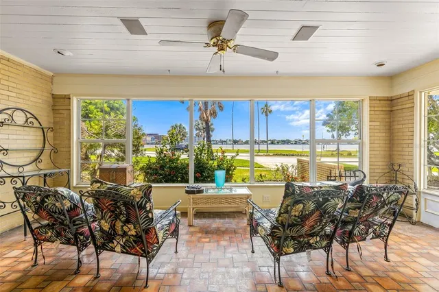 a swimming pool with trees in the background