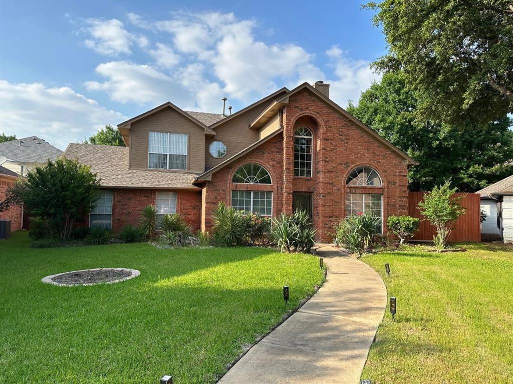 120 Tanbark Circle Coppell, TX 75019 - Photo 1 of 1 a front view of a house with a yard