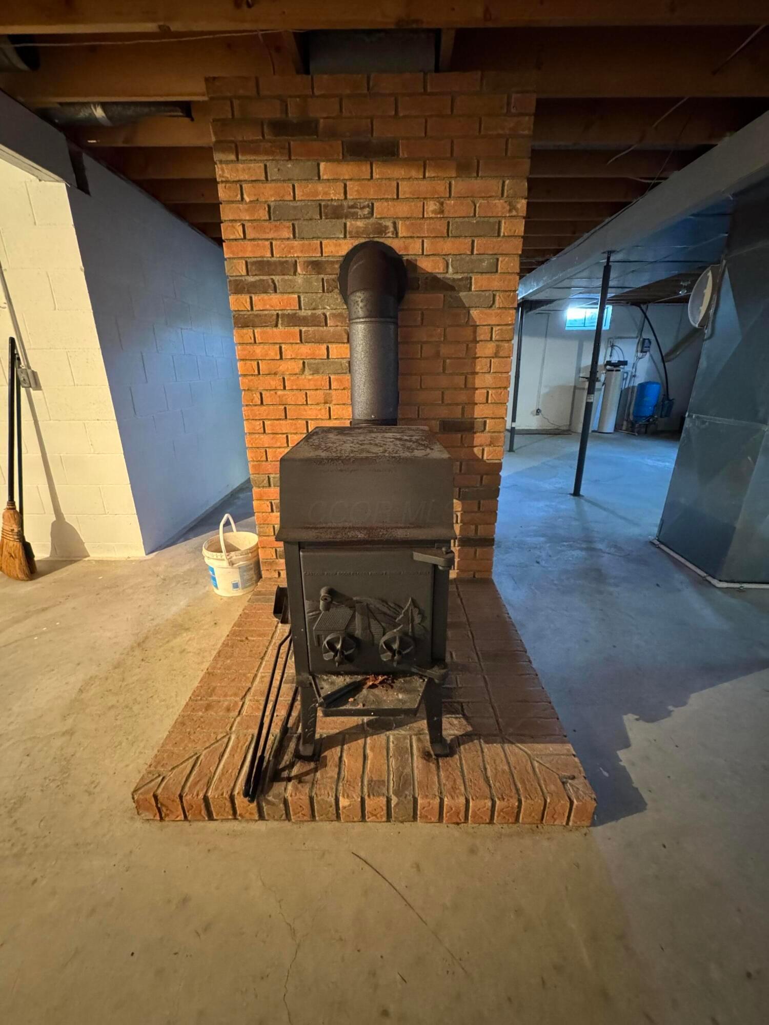 27213 Stuart Road Rockbridge, OH 43149 - Photo 21 of 22 Wood burning stove in basement