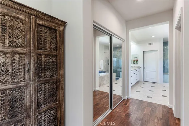 a bathroom with a glass shower door and a bathtub