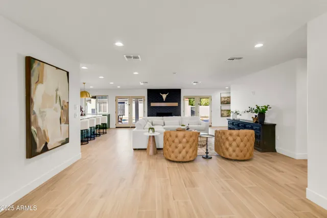 a kitchen with stainless steel appliances granite countertop a sink a stove and cabinets