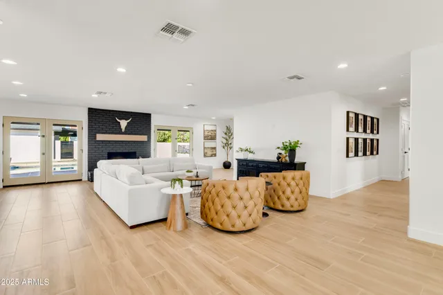 a bathroom with a sink vanity mirror and toilet
