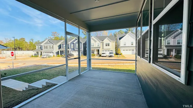 a view of house with outdoor space and sitting area
