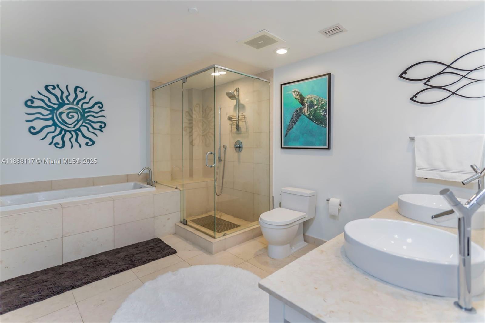 485 Brickell Avenue, Unit 2502 Miami, FL 33131 - Photo 12 of 24 a spacious bathroom with a toilet a sink and bathtub