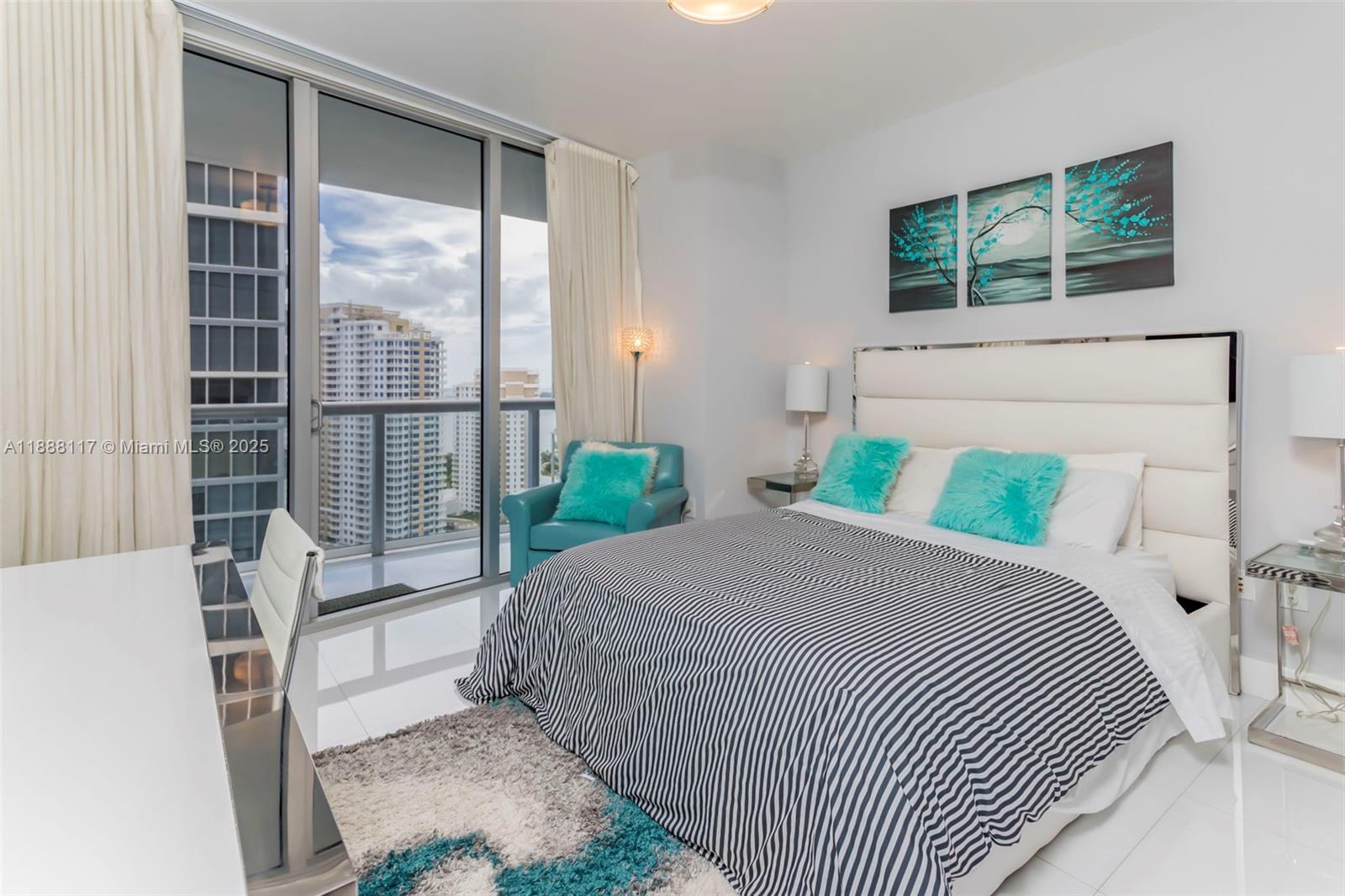 485 Brickell Avenue, Unit 2502 Miami, FL 33131 - Photo 16 of 24 a bedroom with a bed and a window