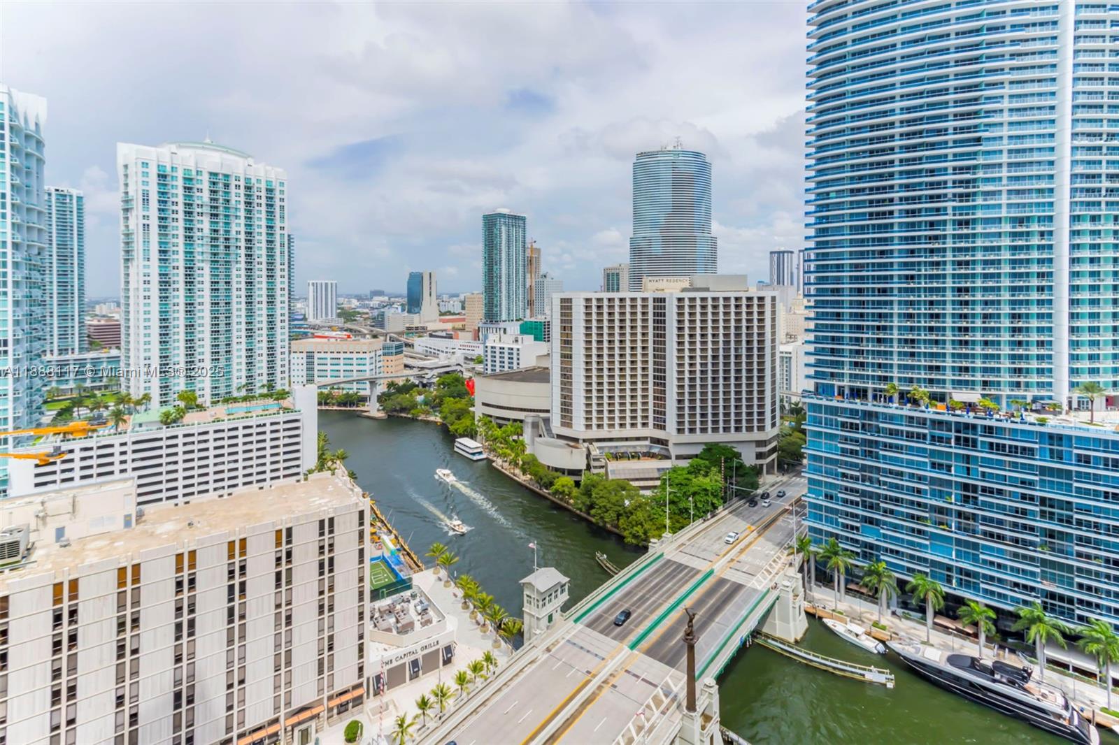 485 Brickell Avenue, Unit 2502 Miami, FL 33131 - Photo 20 of 24 a view of balcony with a couple of cars parked in front of house