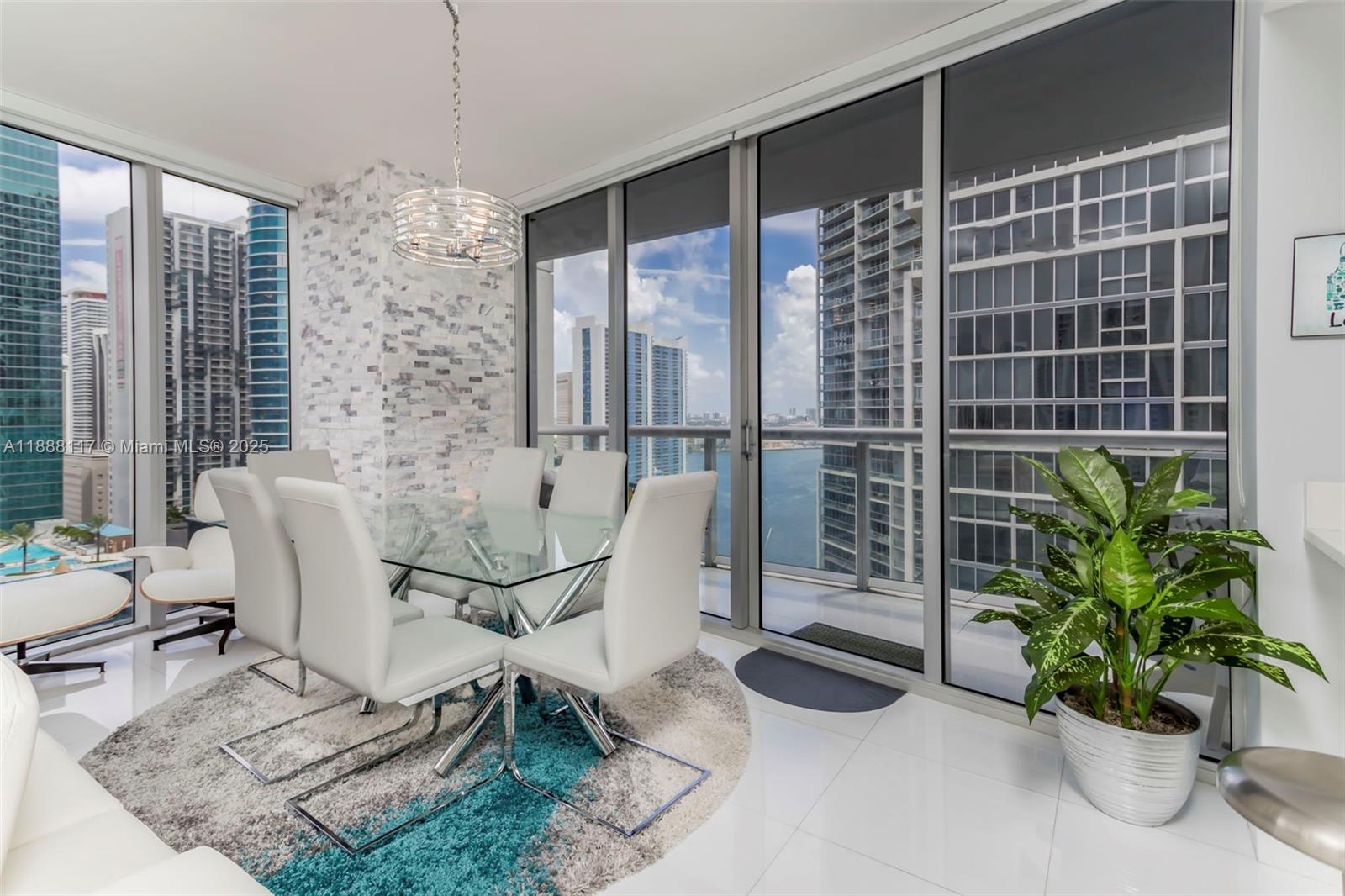 485 Brickell Avenue, Unit 2502 Miami, FL 33131 - Photo 5 of 24 a dining room with furniture and floor to ceiling window