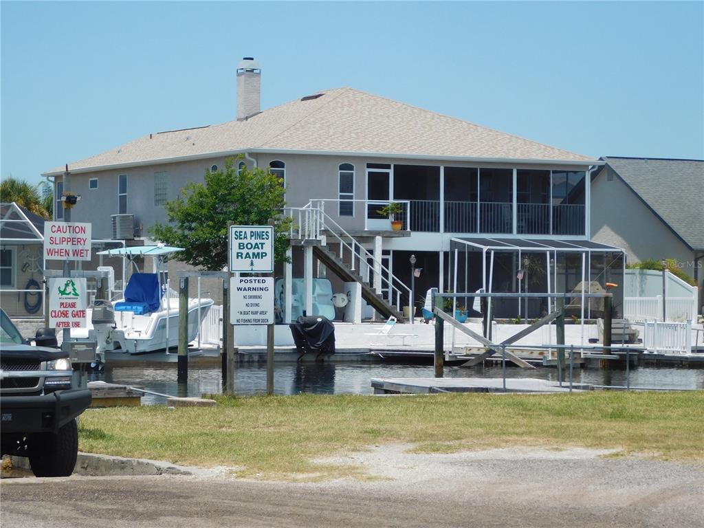 23 Lyle Circle Hudson, FL 34667 - Photo 14 of 14 a view of a swimming pool with table and chairs